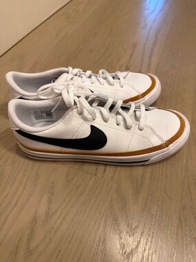 Nike White Low-Top Sneakers with Black Swoosh and Tan Trim